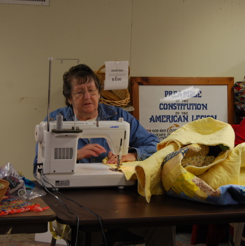 Rebecca binding a quilt